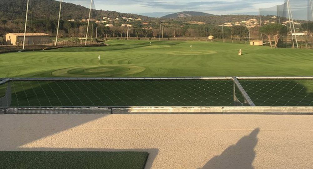 Charlotte Synthetic turf beside natural grass golf course