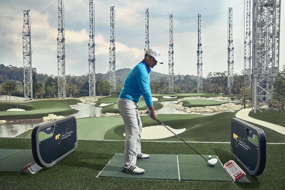 Charlotte Golfer on synthetic grass tee box